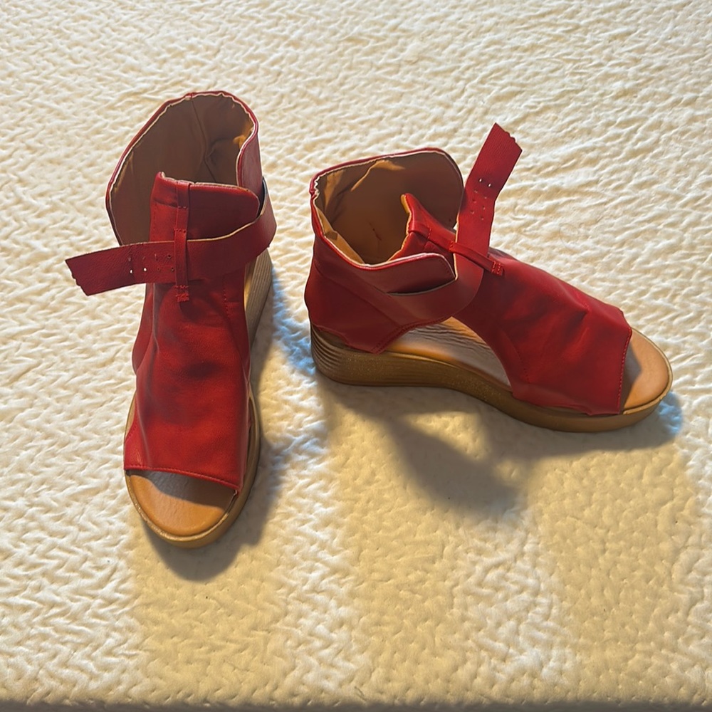 Red Wedge Strapped Heel.